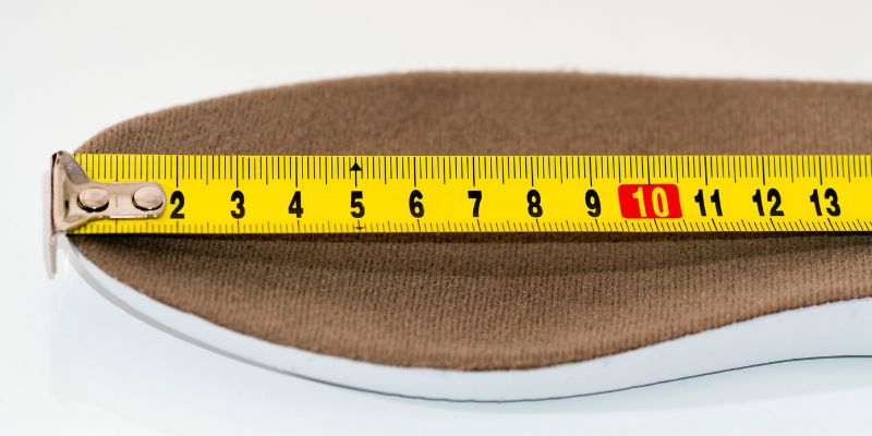 bottom of a shoe being measured.
