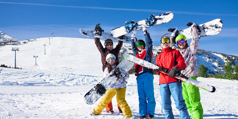 Image of snowboarders and skiers